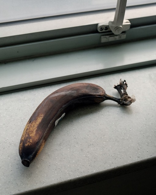 A mostly brown banana